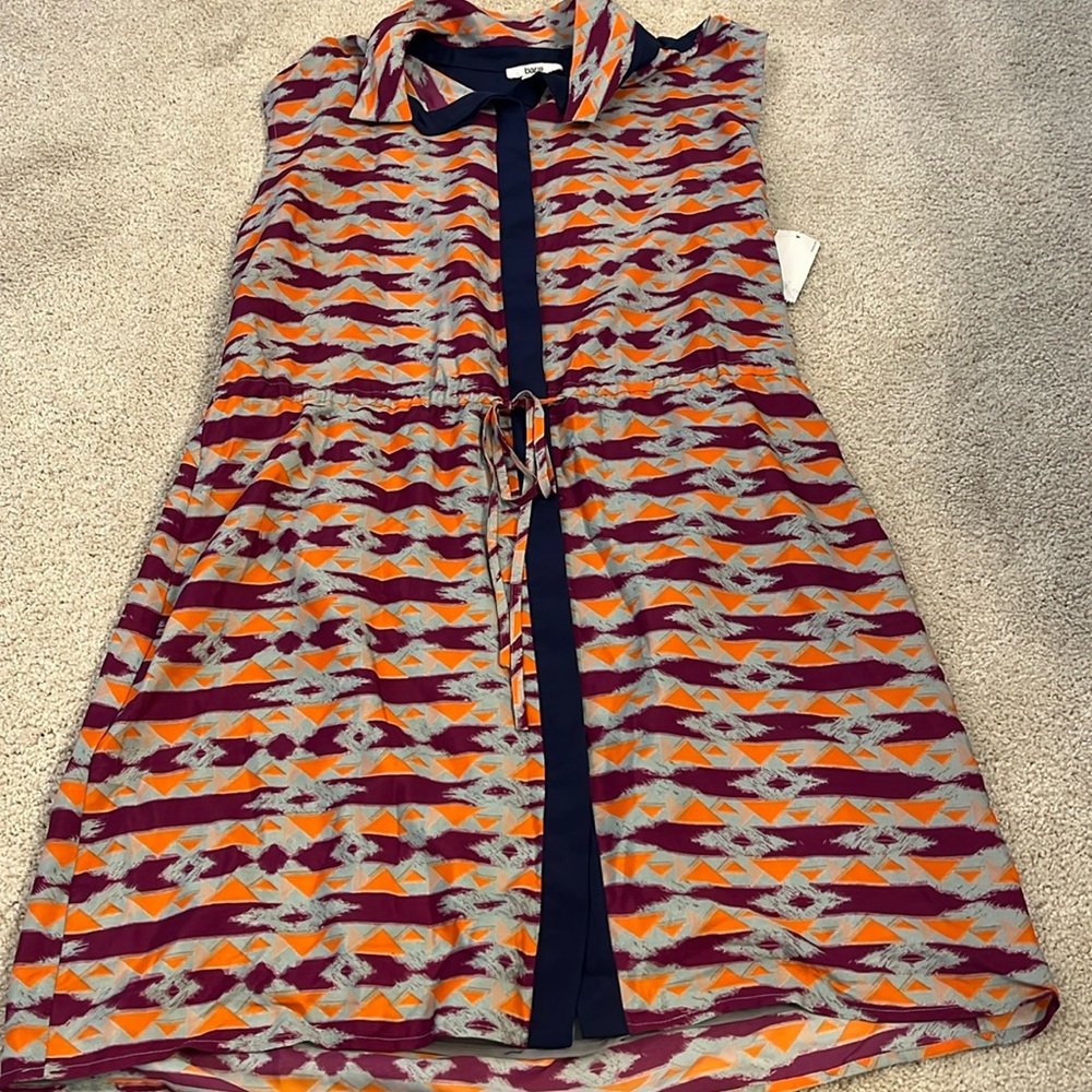 New w/tags and in great shape. Multicolored pattern button up